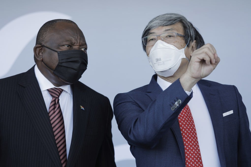 South African President Cyril Ramaphosa (left) and NantWorks founder Patrick Soon-Shiong chat during the inauguration of the NantSA vaccine production facility in Cape Town on Wednesday. Photo: EPA-EFE