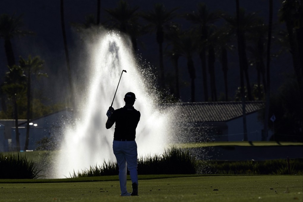 Patrick Cantlay hits from the 18th fairway during the first round of the American Express golf tournament at La Quinta Country Club. Photo: AP