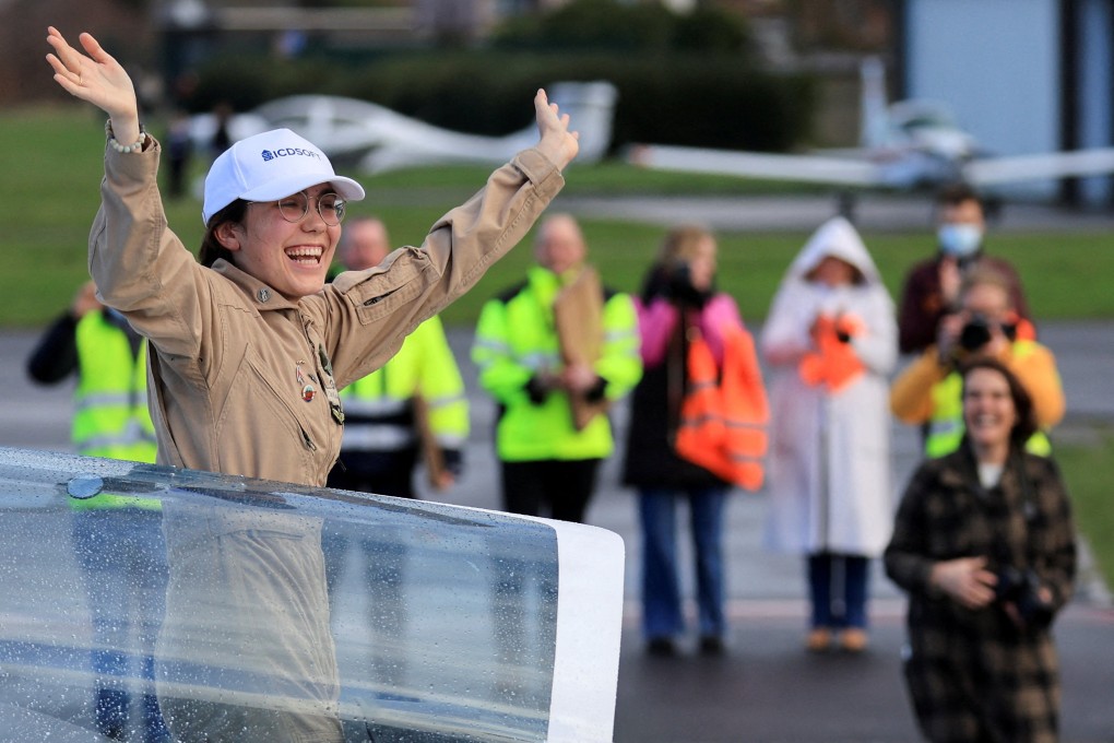 Belgian-British pilot Zara Rutherford, 19, gestures following her landing at Kortrijk-Wevelgem Airport in Belgium on Thursdayafter a round-the-world trip in a light aircraft, becoming the youngest woman pilot to circle the planet alone. Photo: Reuters