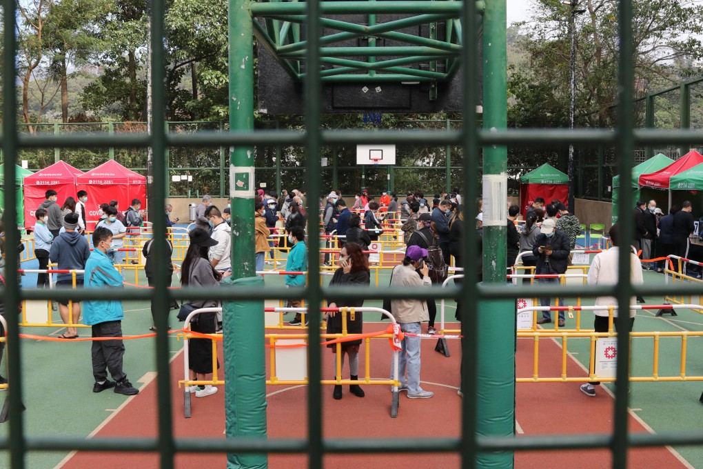 People queue for Covid-19 testing at Yat Kwai House, where at least 16 people have been found to have to contracted the coronavirus. Photo: Jelly Tse