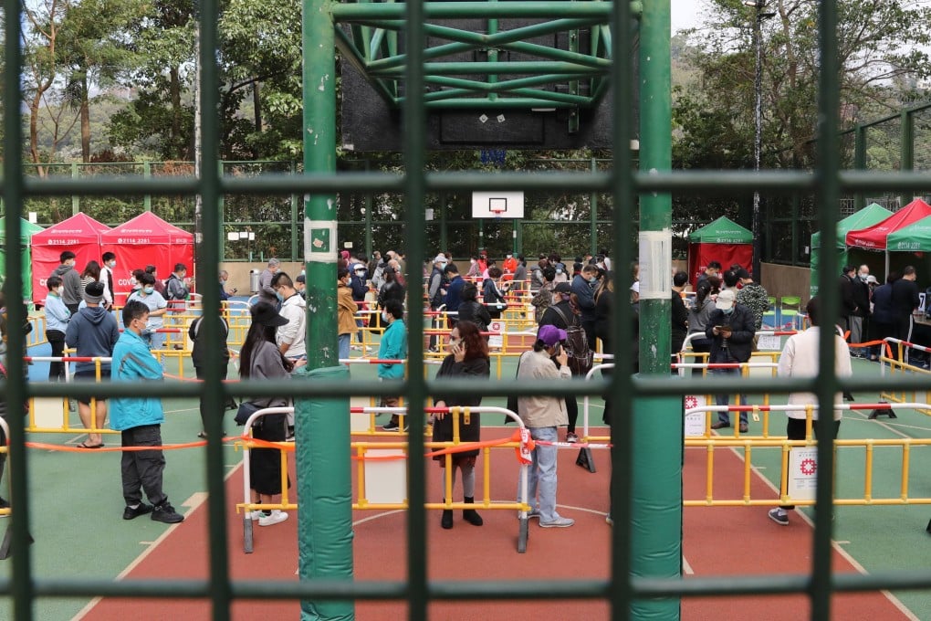 People queue for Covid-19 testing at Yat Kwai House, where at least 16 people have been found to have to contracted the coronavirus. Photo: Jelly Tse