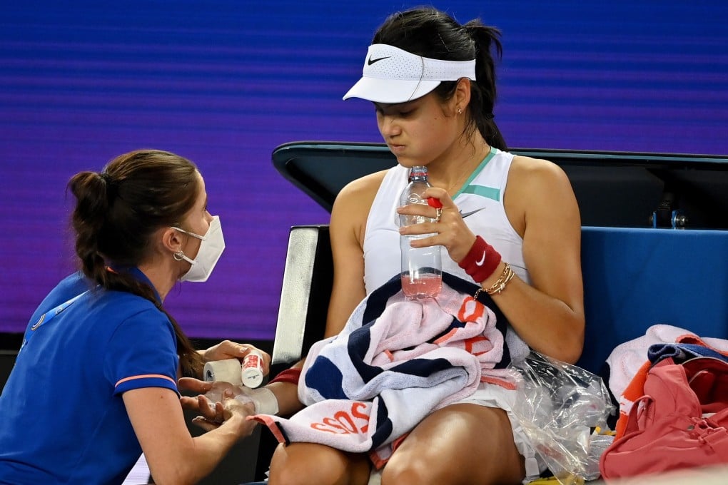 Emma Raducanu receives treatment during a medical time out during the match against Danka Kovinic. Photo: EPA-EFE