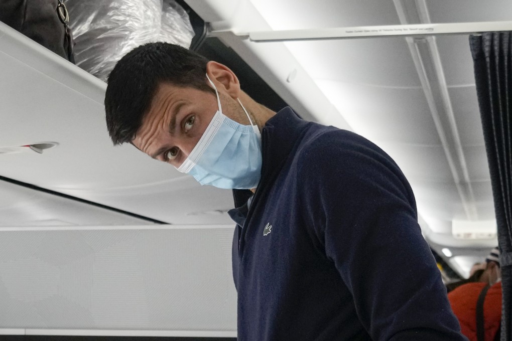 Novak Djokovic prepares to take his seat on a plane to Belgrade, in Dubai, United Arab Emirates, on January 17 after being deported from Australia. Photo: AP/Darko Bandic