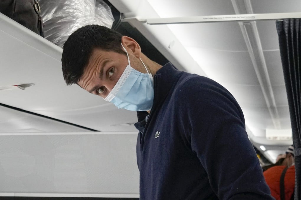 Novak Djokovic prepares to take his seat on a plane to Belgrade, in Dubai, United Arab Emirates, on January 17 after being deported from Australia. Photo: AP/Darko Bandic
