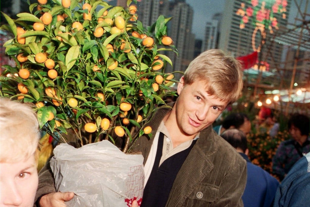 An expatriate purchases a miniature tangerine tree for Lunar New Year at the Flower Market in Victoria Park, Causeway Bay, in 1996. This and giving lai see is still the extent of many foreigners’ involvement in the festival. Photo: SCMP
