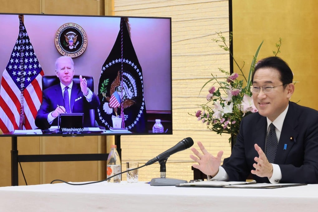 Japanese Prime Minister Fumio Kishida talks in a virtual meeting on Friday with US President Joe Biden, shown on the monitor. Photo: Kyodo News via AP