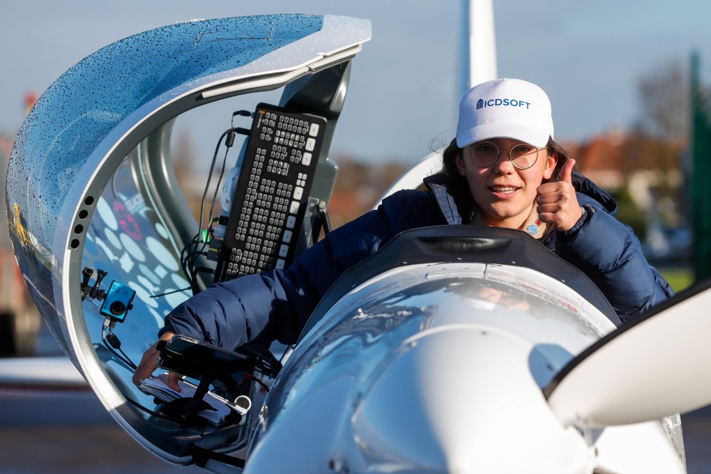 Belgian-British pilot Zara Rutherford poses for photographs after landing in Wevelgem, Belgium on January 20. Photo: EPA-EFE