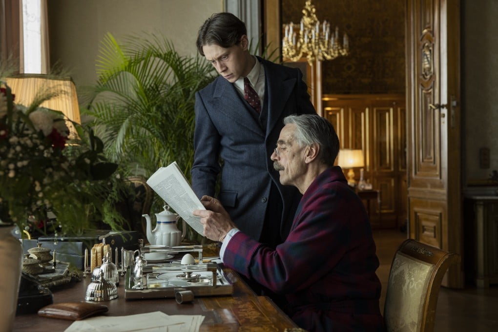 George MacKay (top) as Hugh Legat and Jeremy Irons as Neville Chamberlain in a still from Munich: The Edge of War. Photo: Frederic Batier/Netflix.