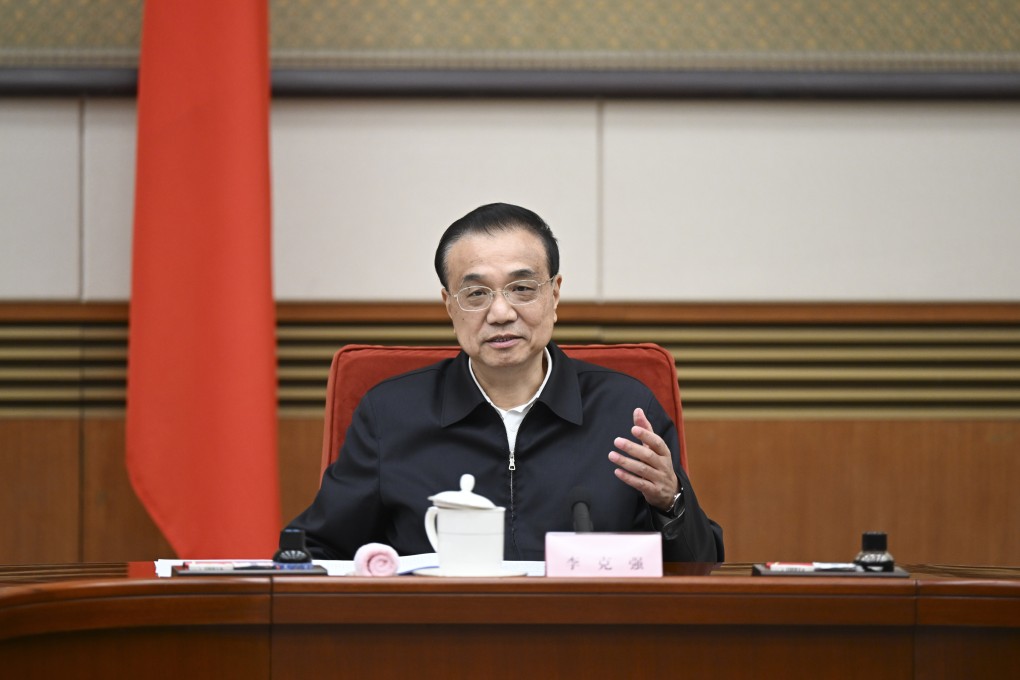 Chinese Premier Li Keqiang, a member of the Standing Committee of the Political Bureau of the Communist Party of China (CPC) Central Committee, talks with representatives from the education, science and technology, culture, health, and sports sectors at a symposium to hear their opinions on a draft government work report on January 21, 2022. Photo: Xinhua