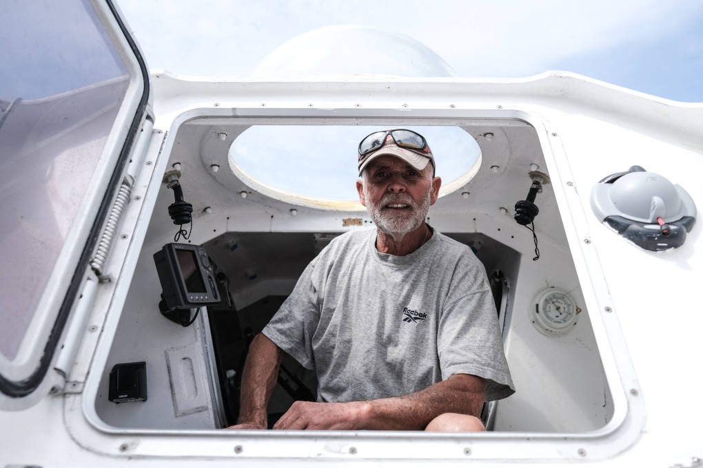 Jean-Jacques Savin poses on his boat at a shipyard in Lege-Cap-Ferret, southwestern France, in 2021. Photo: AFP