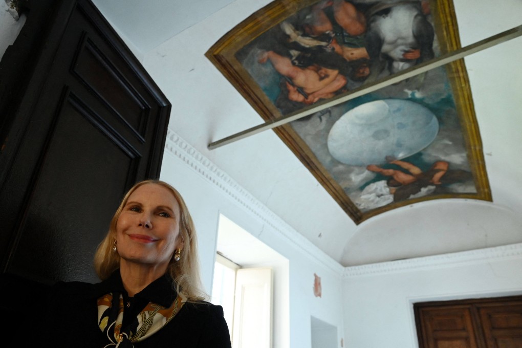 Princess Rita Boncompagni Ludovisi poses in front of “Jupiter, Neptune and Pluto”, the only known ceiling painting by Caravaggio, in the Villa Boncompagni Ludovisi in Rome. She is trying to sell the villa to settle an inheritance feud, and hopes the Italian state will buy it. Photo: AFP