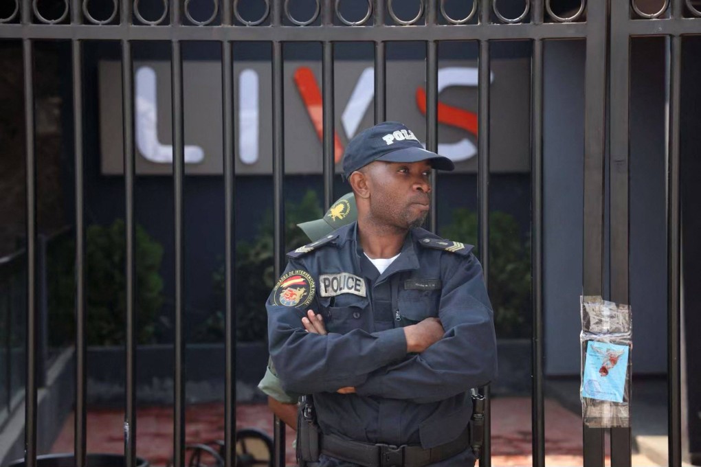 A policeman stands guard at the entrance of the Livs night-club where a deadly fire occurred in Yaounde, Cameroon on January 23. Photo: AFP