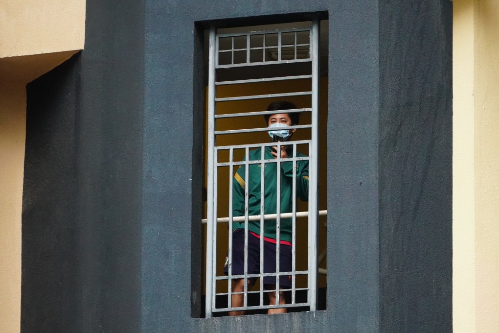 A resident of one of the two public housing blocks in Kwai Chung that went into lockdown on January 21 and 22. The rapid spread of the Omicron variant may make it necessary for close contacts to quarantine at home, but not all households are prepared for such measures. Photo: Felix Wong