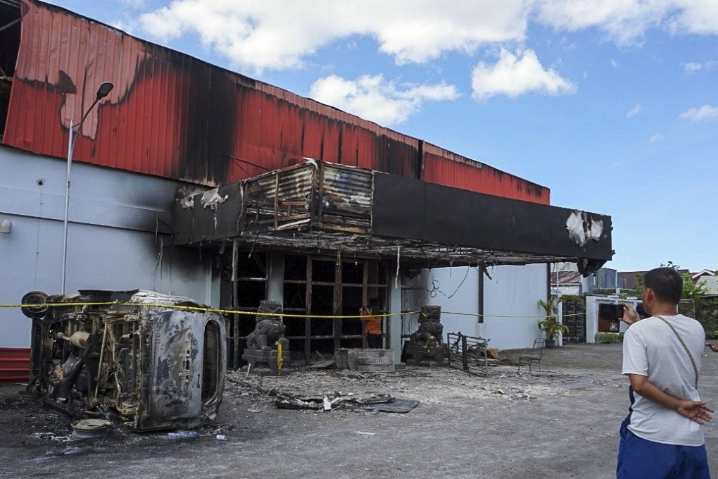 The torched karaoke bar in Sorong, West Papua province. Photo: EPA-EFE