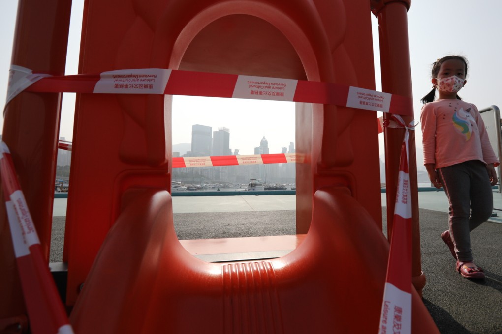 A child walks past barricaded play equipment in Wan Chai on January 7. Photo: Martin Chan