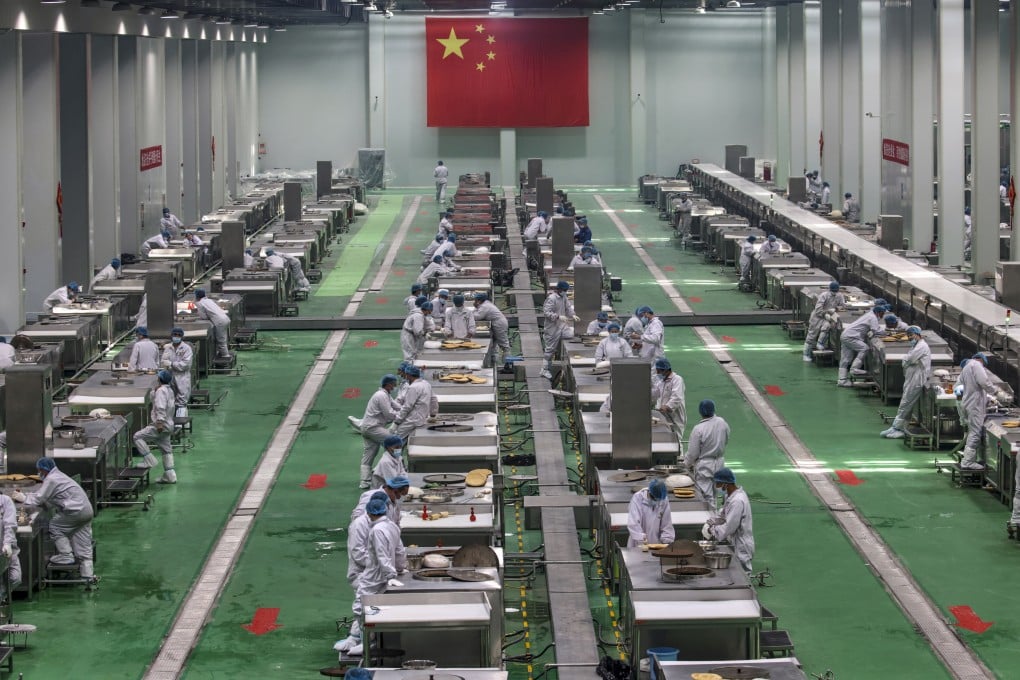 Workers at a nang food production factory in western China’s Xinjiang region, where forced labour is suspected. Photo: EPA-EFE
