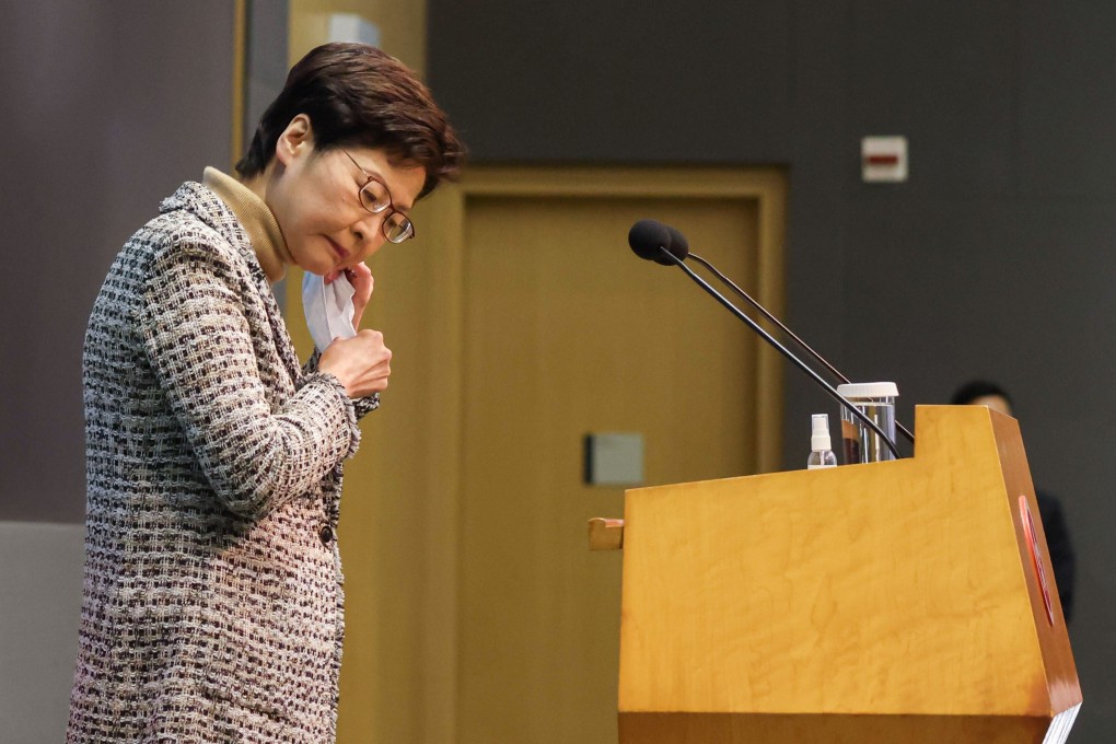 Chief Executive Carrie Lam Cheng Yuet-ngor removes her mask as she meets the press before an executive council meeting. Photo: May Tse