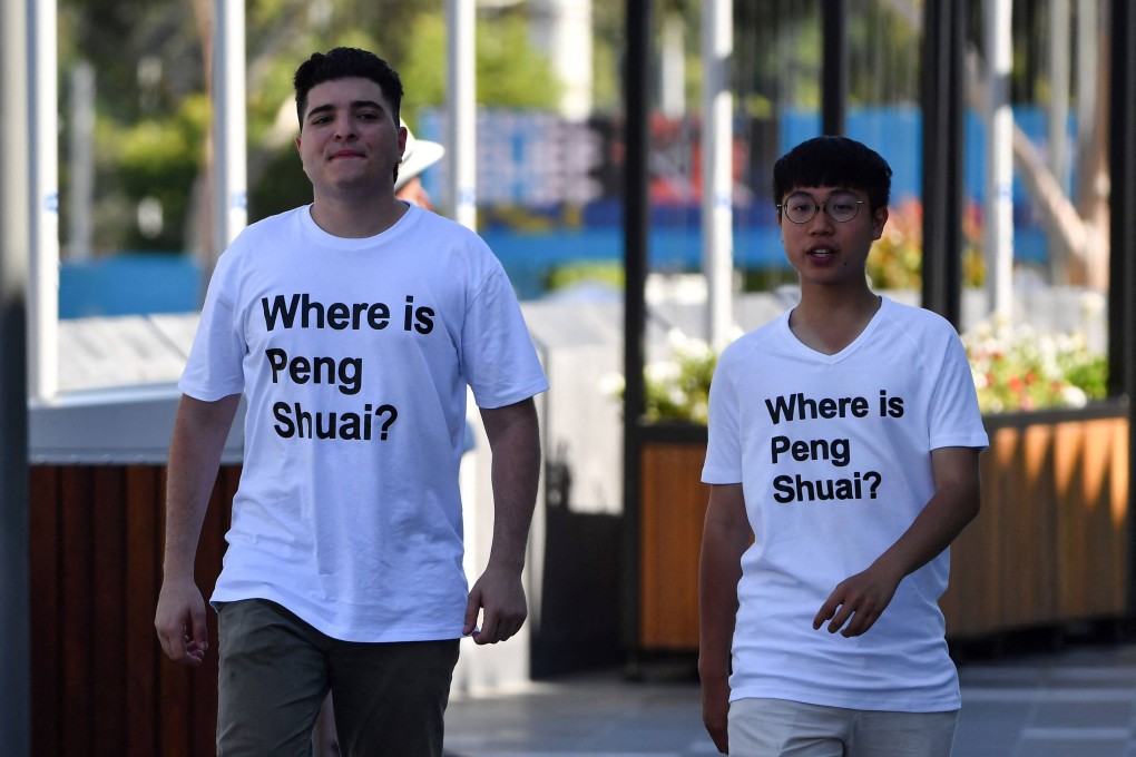 Two spectators wearing “Where is Peng Shuai?” T-shirts, at the Australian Open. Photo: AFP