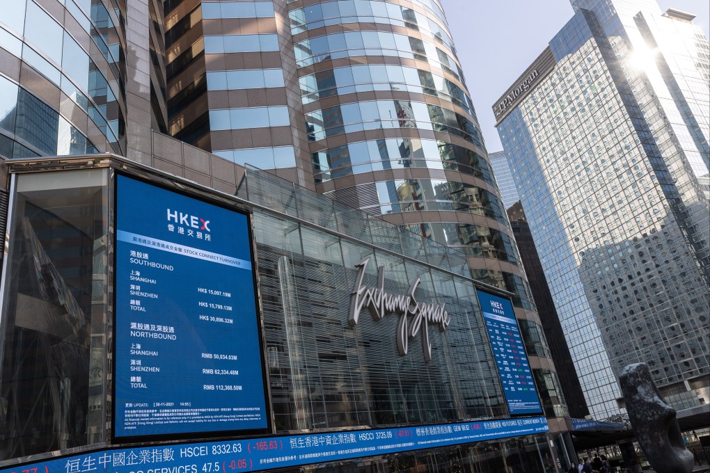 Electronic billboards display stock transactions on Exchange Square, the building housing the Hong Kong stock exchange. Photo: EPA-EFE