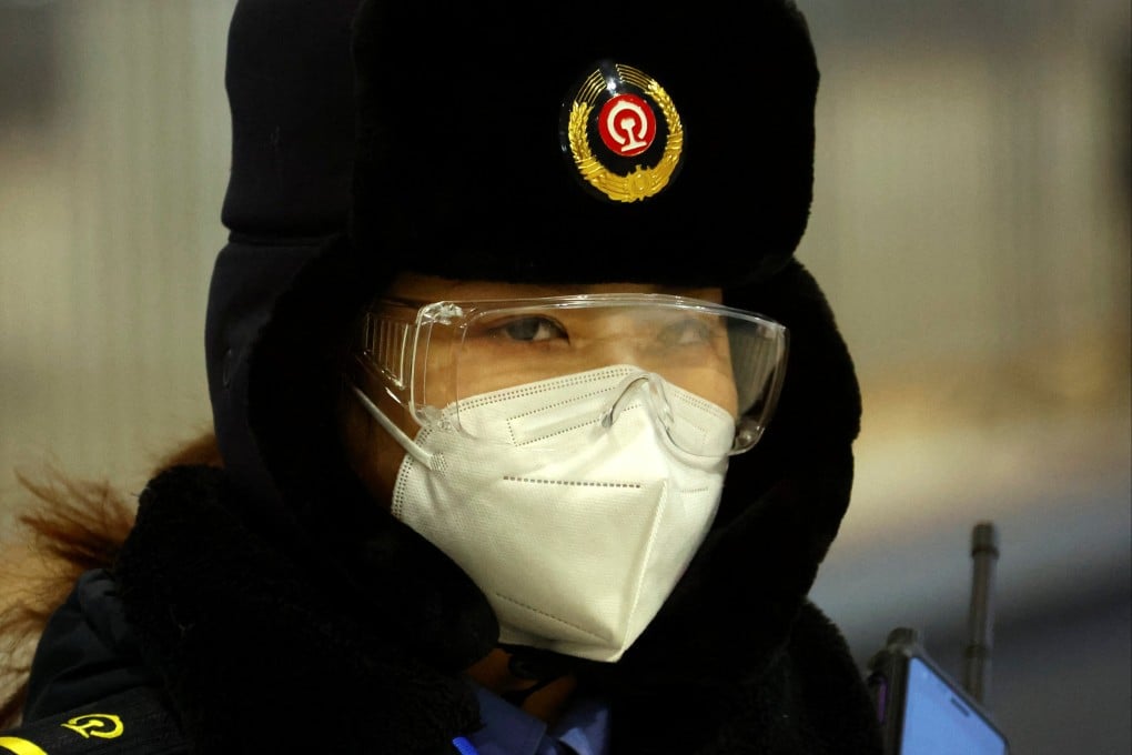 A member of staff stands on the platform at Zhangjiakou cluster train station inside the closed loop. Photo: Reuters
