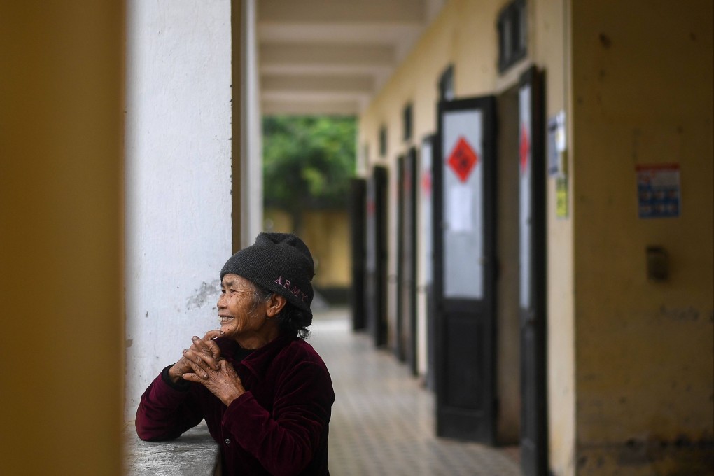 A leprosy survivor stands outside a room at the Van Mon Leprosy hospice compound in Thai Binh province, Vietnam, on January 20, 2019. With early detection and treatment, leprosy can be cured without complications. Photo: AFP