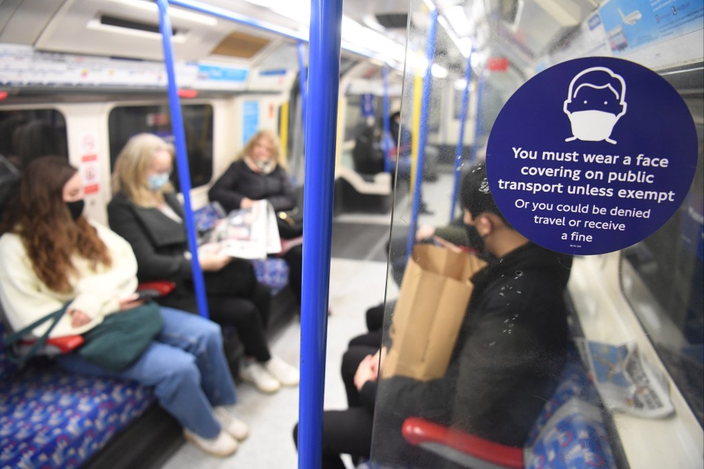 Passengers on London’s transport network will still be required to wear face masks. Photo: EPA