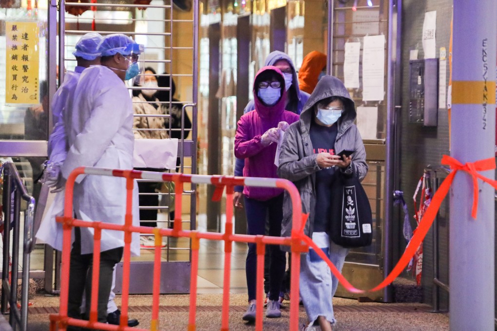 Residents emerge from Yat Kwai House at Kwai Chung Estate on Friday after a week-long lockdown there was lifted. Photo: Jelly Tse