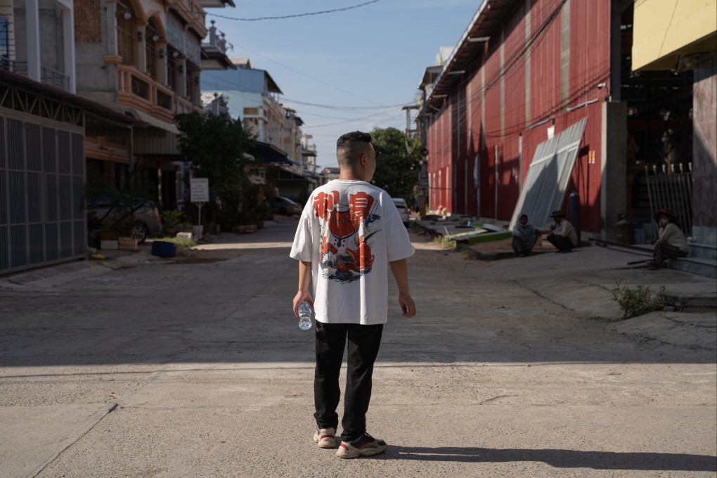 Xu Mingjian takes a walk near the safe house where he is staying in Phnom Penh, Cambodia. Xu jumped from the second floor of the Sihanoukville building where he had been imprisoned for three months running online scams, ending up in hospital. Photo Cindy Liu