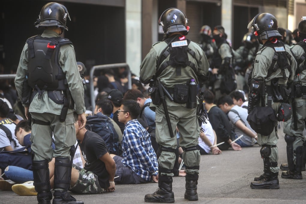 Riot police make arrests after clashes with protesters at Polytechnic University in Hung Hom in November 2019. Photo: Winson Wong
