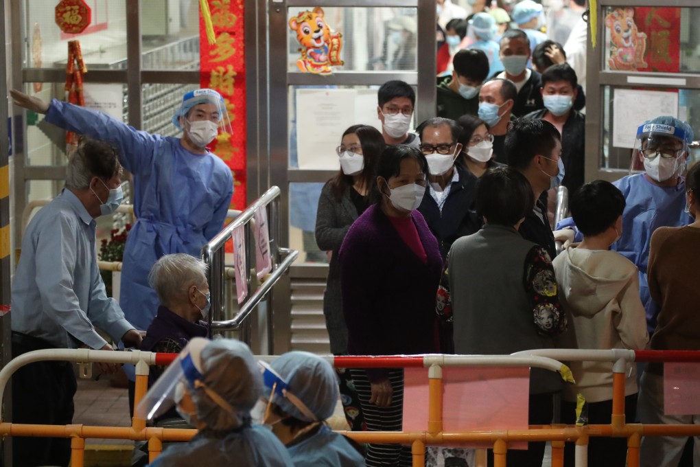 Residents of Cheung Bor House at the Choi Wan Estate in Wong Tai Sin undergo mandatory tests as part of a government lockdown on January 26. One security guard and two residents tested positive for Covid-19. Photo: Edmond So