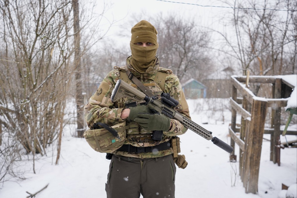 A Ukrainian sniper poses for a photo before moving to the front line in eastern Ukraine on Friday. High-stakes diplomacy continued in a bid to avert a war in Eastern Europe, with 100,000 Russian troops massed near Ukraine’s border and the US and other nations worried that Russian President Vladimir Putin will mount some sort of invasion within weeks. Photo: AP