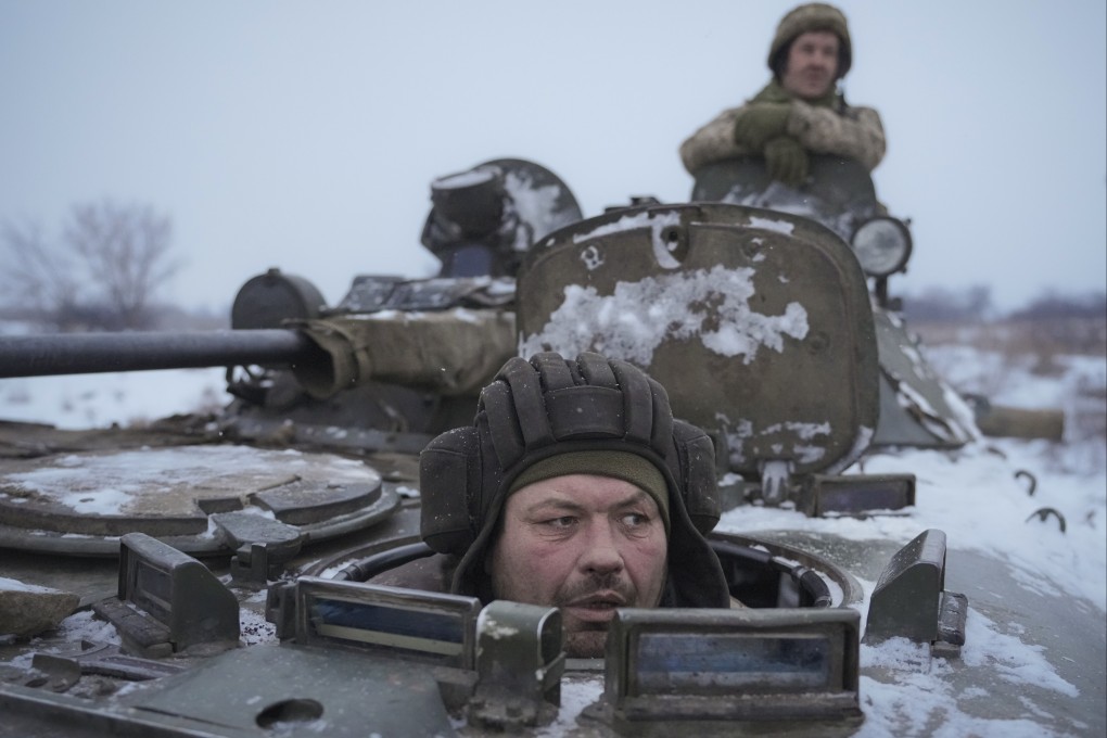 Ukrainians drive in an armored personnel carrier near the frontline position in the Luhansk area in eastern Ukraine on Friday. Photo: AP