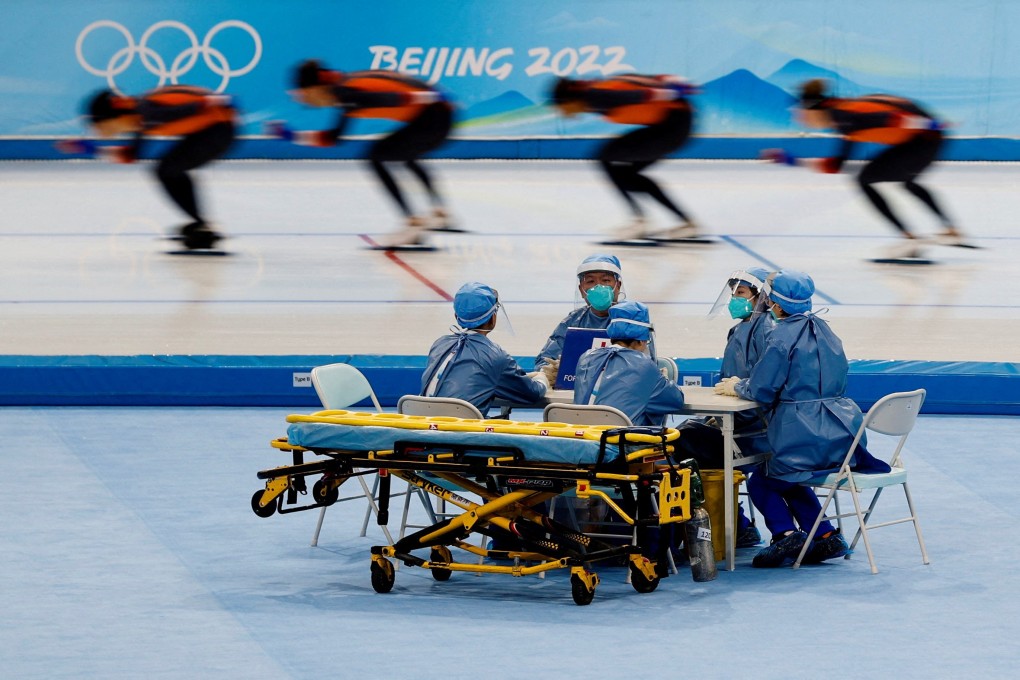 Medical staff in personal protective equipment stand by at a speed skating training session for the Beijing 2022 Winter Olympics on Friday. Photo: Reuters