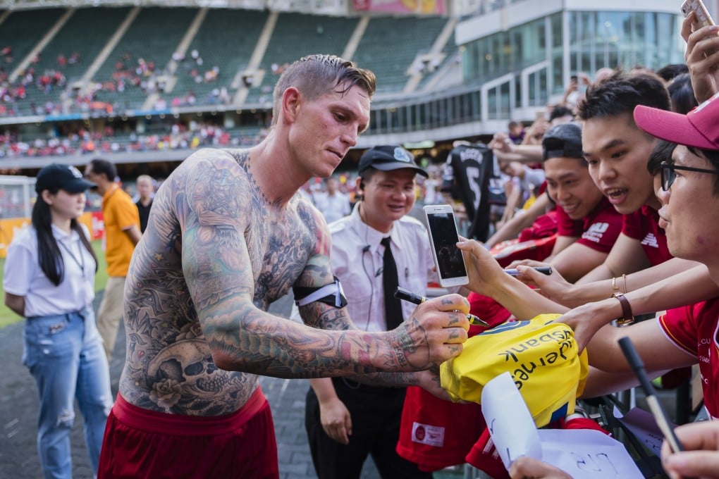 Daniel Agger shows off his tattoos during a Liverpool alumni game at Hong Kong Stadium. Photo: Getty Images