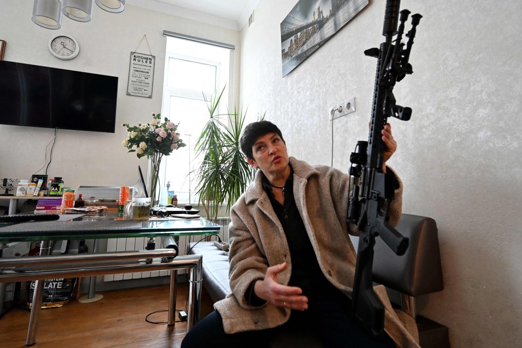 Mariana Jaglo, a Ukrainian mother-of-three, talks while holding her rifle. As fears grow of a potential invasion by Russian troops massed on Ukraine’s border, the 52-year-old army reservist said she was willing to fight to defend her country. Photo: AFP