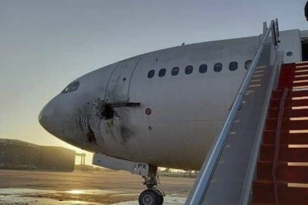 A damaged aircraft on the tarmac of Baghdad airport, after a rocket attack on Friday. Photo: via AP