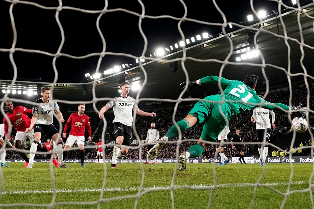 Manchester United’s Odion Ighalo scores his side’s
second goal in their FA Cup fifth round game against Derby County in 2020. Photo: Reuters