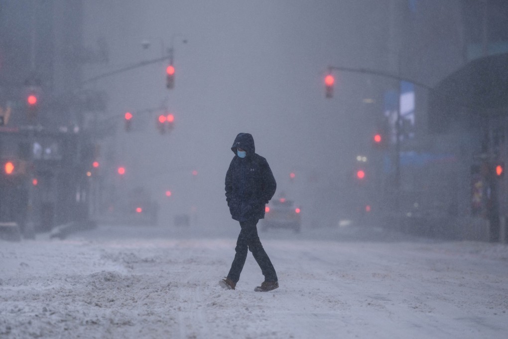 A pedestrian makes his way through heavy snow in Times Square, New York on January 29,  Photo: AFP