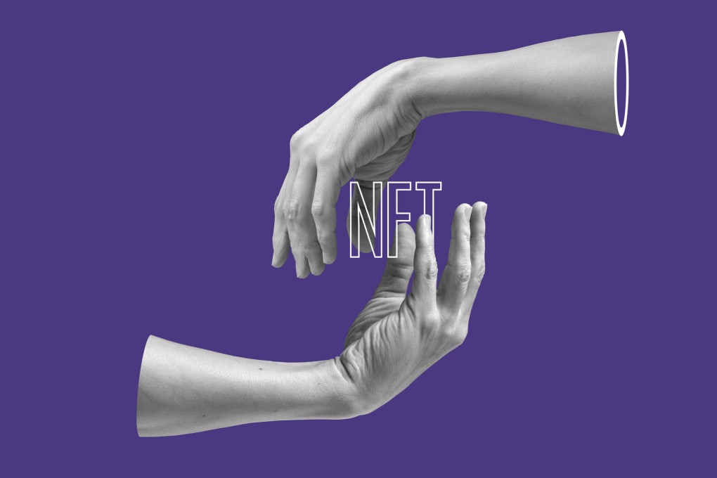 A non-fungible token exchanged between hands. Photo: Getty Images
