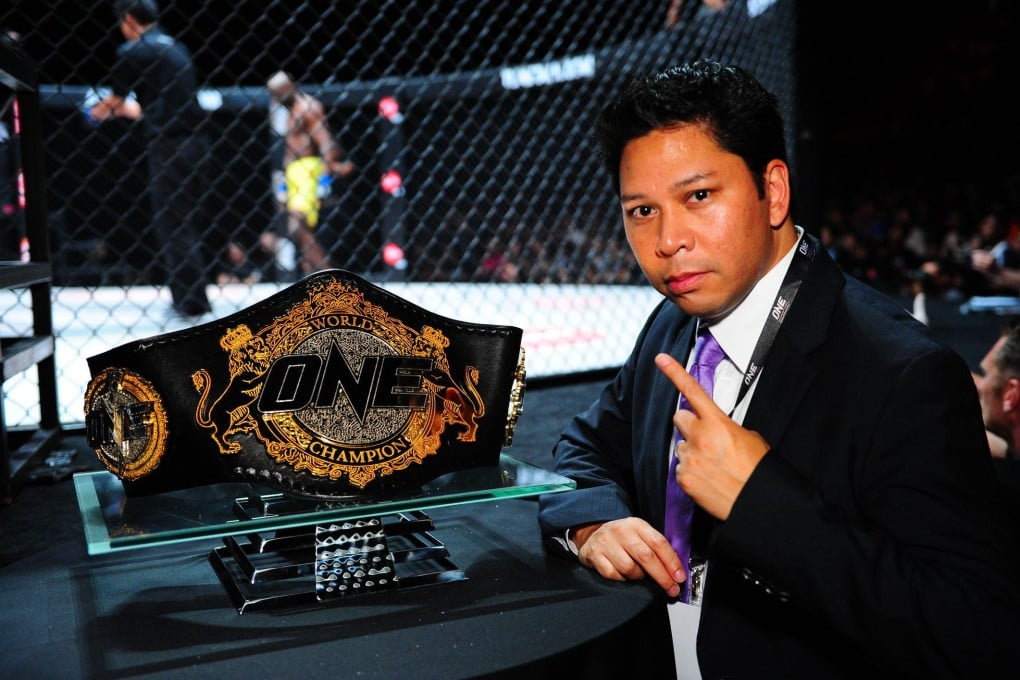 Victor Cui poses with a ONE title belt. Photo: ONE Championship