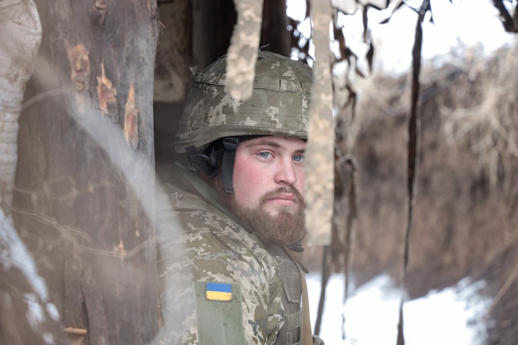 A Ukrainian serviceman rests at the front line on Monday, not far from the city of Horlivka, which is controlled by pro-Russian militants. Photo: EPA-EFE