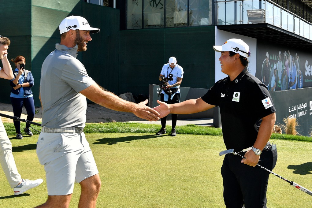 Dustin Johnson and Joohyung Kim meet on the putting green on Tuesday at the Royal Greens Golf and Country Club. Photo: Asian Tour.