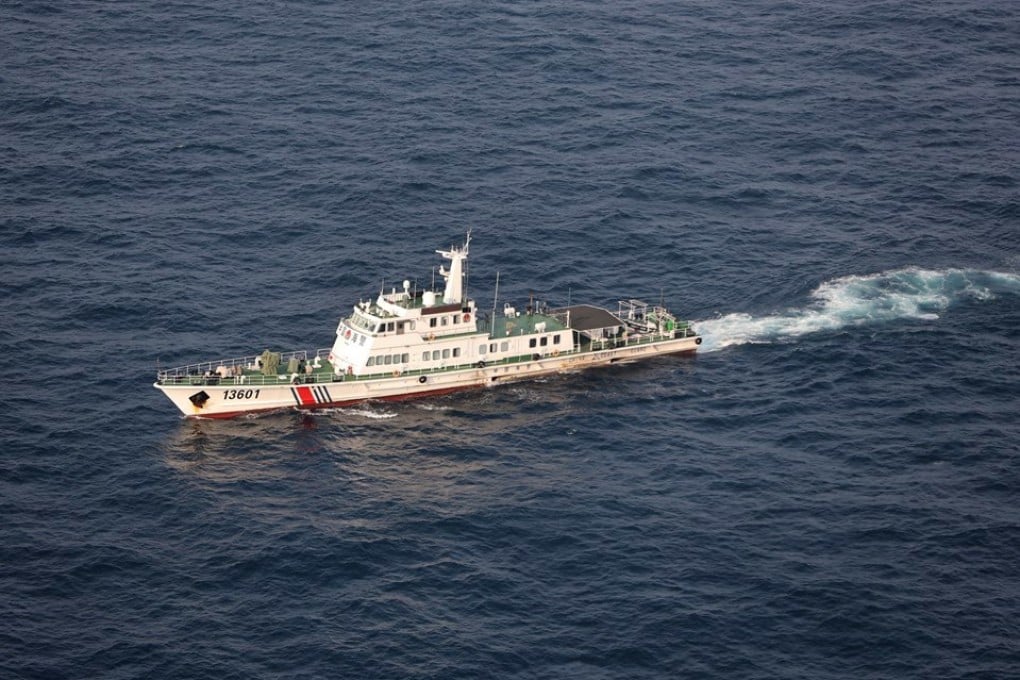 A Chinese coastguard ship cruising near disputed islands known by China as the Diaoyus and by Japan as the Senkakus. Photo: EPA
