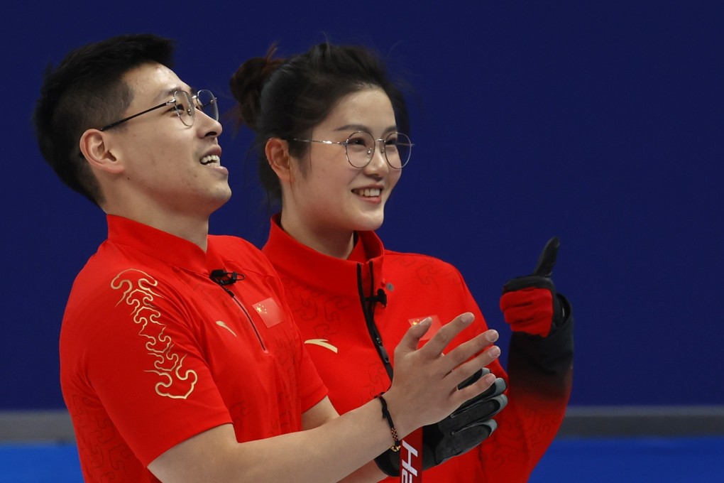 Fan Suyuan (right) and Ling Zhi of China react during their curling mixed doubles round robin match against Switzerland at the Beijing 2022 Olympic Games. Photo: EPA-EFE/Roman Pilipey