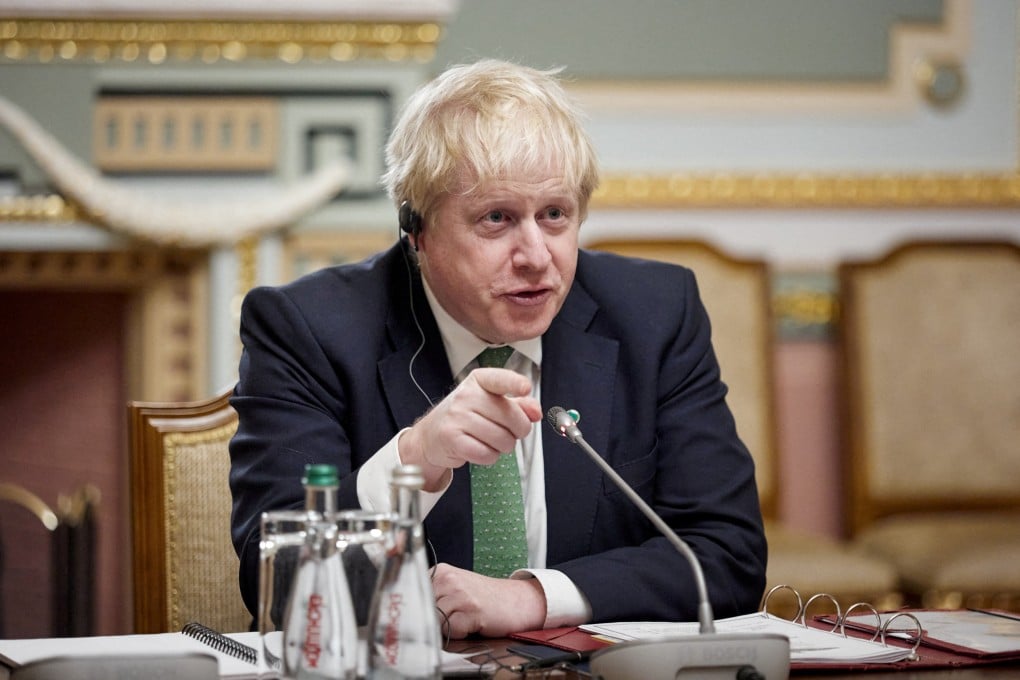 British Prime Minister Boris Johnson in talks with the Ukrainian President on Tuesday. He is weathering a political storm at home over the ‘partygate’ scandal. Photo: Handout via Reuters