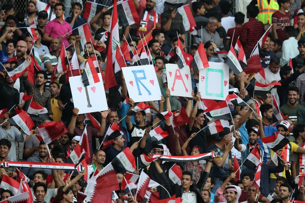 Iraq fans cheer for their team during a football match between Iraq and Qatar in Basra in this file photo taken on March 21, 2018. Photo: AFP