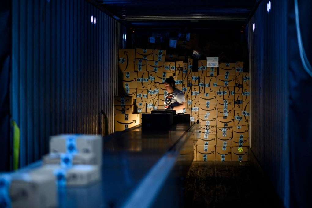 A woman works at the Amazon fulfillment centre in Staten Island, New York City, on February 5, 2019. Service wages are the only part of the price structure that the Fed’s new policy can affect directly. Photo: AFP