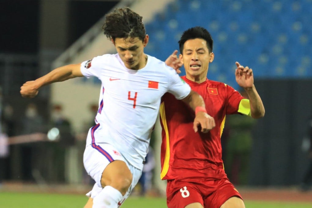 Wang Shenchao (left) of China vies with Do Hung Dung of Vietnam during their Group B in Fifa World Cup Qatar 2022 qualification in Hanoi. Photo: VNA/Handout via Xinhua