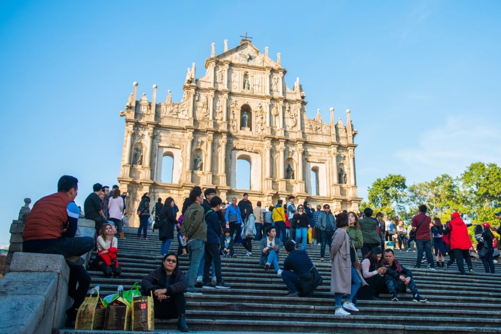 Tourists in Macau at the ruins of St. Paul’s Church. Photo: Shutterstock