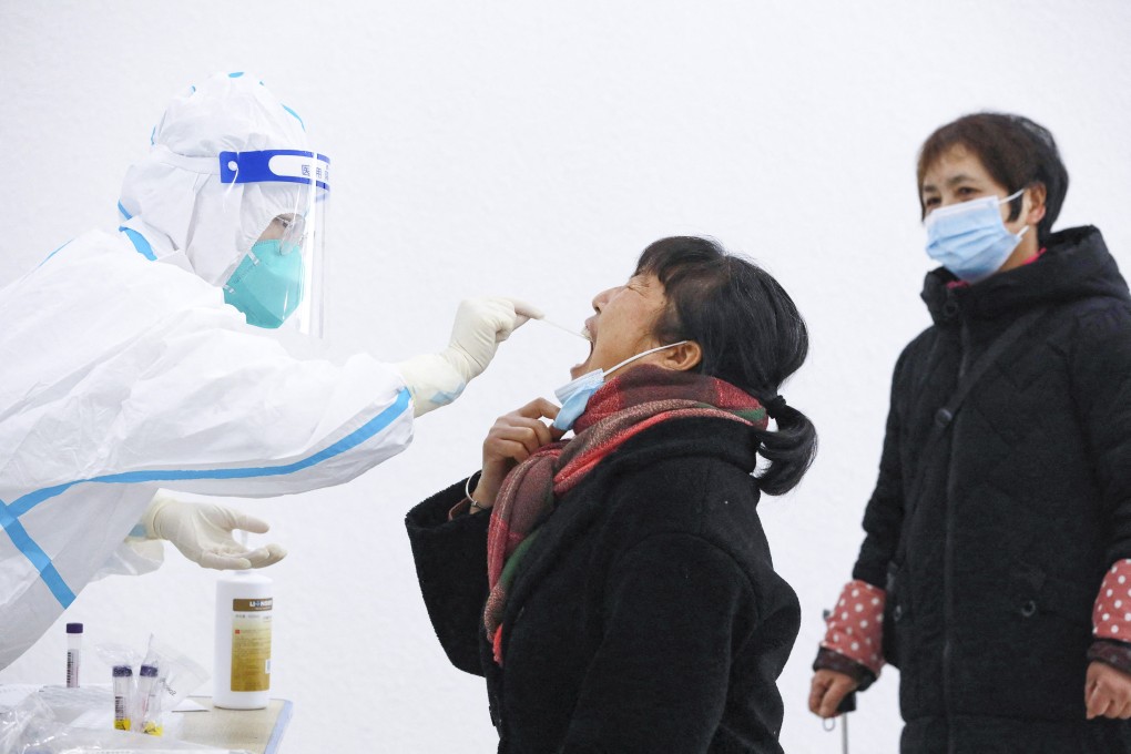 A resident undergoes a Covid-19 test in Hangzhou. Photo: AFP